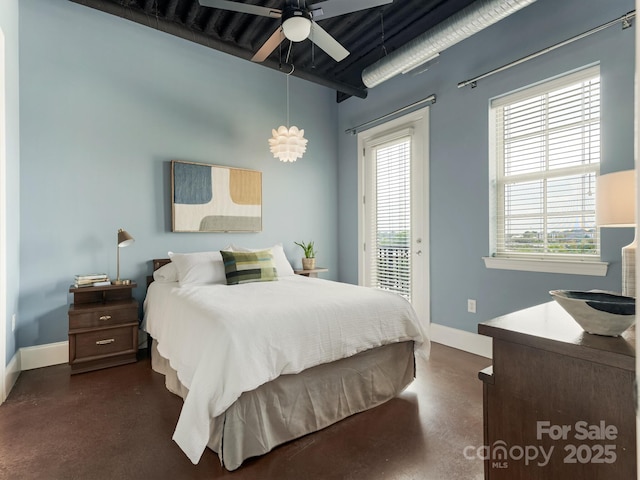 2338 Yadkin Ave Unit 505, Charlotte, NC 28205 - bedroom with finished concrete flooring, access to outside, multiple windows, and a ceiling fan