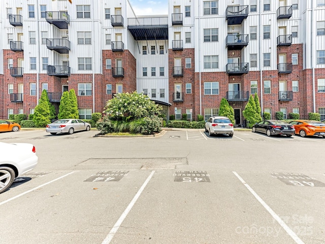 2338 Yadkin Ave Unit 505, Charlotte, NC 28205 - view of apartment building / complex featuring uncovered parking