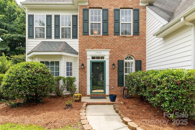 1993 W Foxwood Ct, Indian Land, SC 29707 - doorway to property featuring brick siding and roof with shingles
