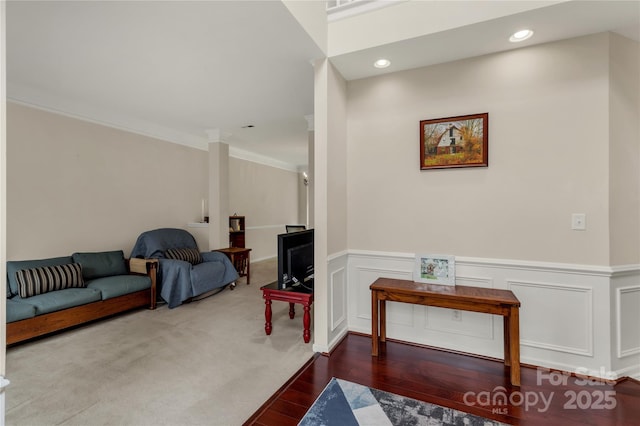1993 W Foxwood Ct, Indian Land, SC 29707 - living area with wood finished floors, a wainscoted wall, crown molding, a decorative wall, and recessed lighting