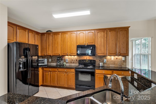 1993 W Foxwood Ct, Indian Land, SC 29707 - kitchen featuring black appliances, light tile patterned floors, decorative backsplash, and brown cabinets