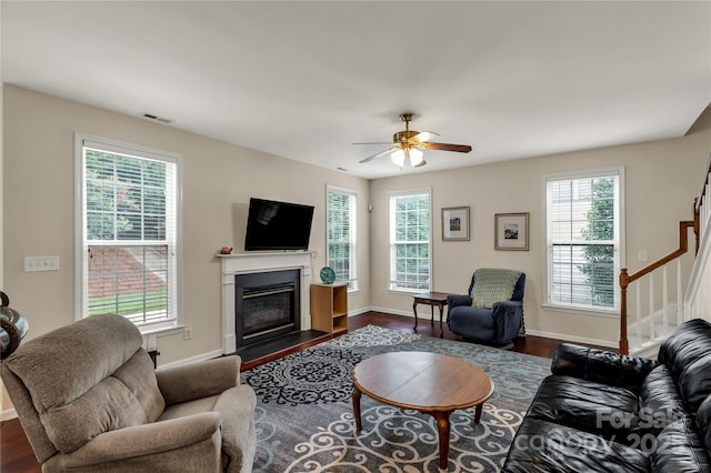 1993 W Foxwood Ct, Indian Land, SC 29707 - living area with plenty of natural light, stairway, a fireplace with flush hearth, and a ceiling fan