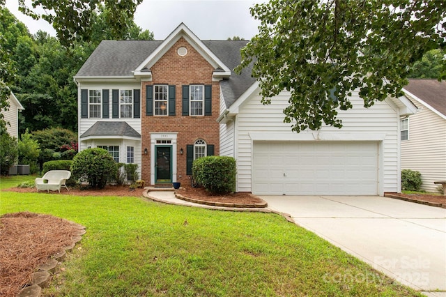 1993 W Foxwood Ct, Indian Land, SC 29707 - colonial house featuring brick siding, driveway, a front yard, and roof with shingles