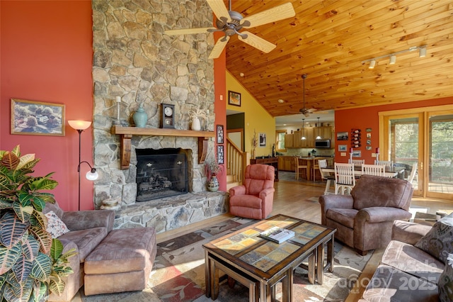 425 Sawmill Creek Rd, Bryson City, NC 28713 - living area with ceiling fan, a fireplace, high vaulted ceiling, wood finished floors, and wood ceiling