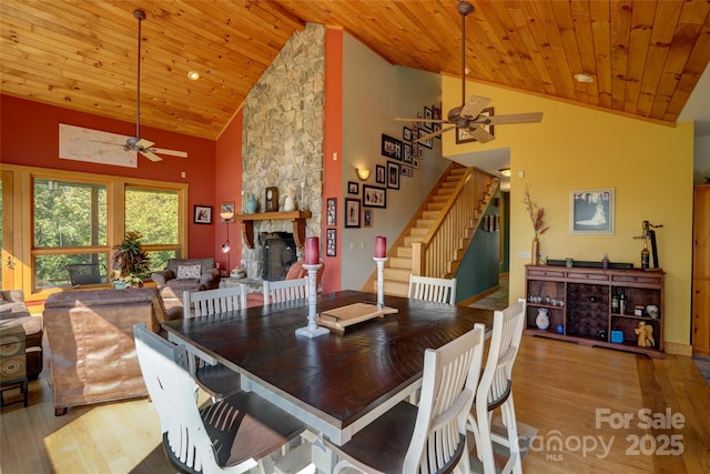 425 Sawmill Creek Rd, Bryson City, NC 28713 - dining space featuring ceiling fan, high vaulted ceiling, wood finished floors, a fireplace, and wood ceiling