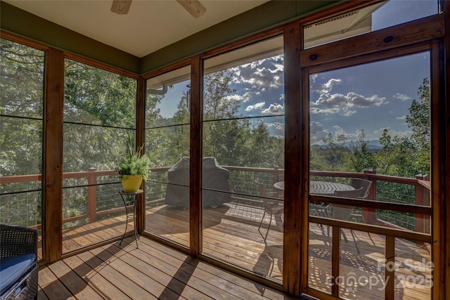425 Sawmill Creek Rd, Bryson City, NC 28713 - unfurnished sunroom featuring a deck, a ceiling fan, and wood finished floors