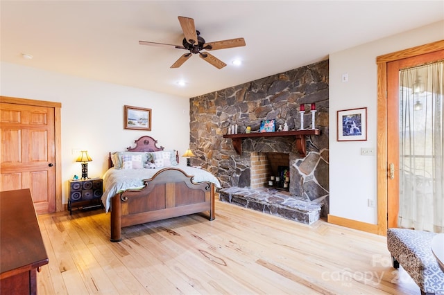 425 Sawmill Creek Rd, Bryson City, NC 28713 - bedroom featuring wood finished floors, ceiling fan, a stone fireplace, and recessed lighting