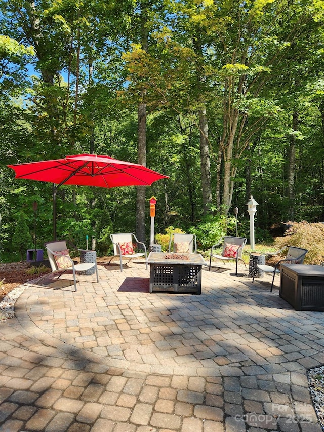 425 Sawmill Creek Rd, Bryson City, NC 28713 - view of patio featuring an outdoor fire pit