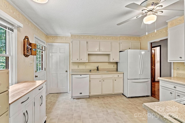 1408 Kensington Cir, Newton, NC 28658 - kitchen featuring white appliances, light countertops, ceiling fan, wallpapered walls, and backsplash