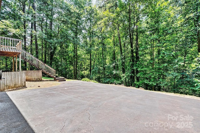 1408 Kensington Cir, Newton, NC 28658 - view of patio / terrace featuring stairway and a wooded view