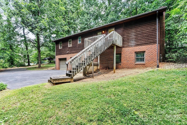 1408 Kensington Cir, Newton, NC 28658 - back of house with stairs, driveway, a lawn, and a garage