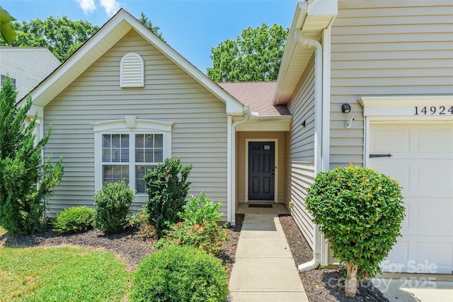 14924 Jerpoint Abby Dr, Charlotte, NC 28273 - view of exterior entry featuring a garage
