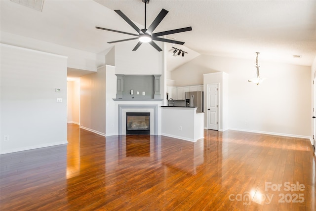 14924 Jerpoint Abby Dr, Charlotte, NC 28273 - unfurnished living room with a ceiling fan, high vaulted ceiling, and wood finished floors
