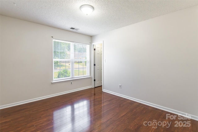 14924 Jerpoint Abby Dr, Charlotte, NC 28273 - empty room with a textured ceiling and wood finished floors