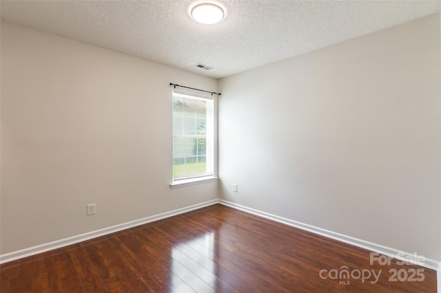 14924 Jerpoint Abby Dr, Charlotte, NC 28273 - empty room with wood finished floors and a textured ceiling