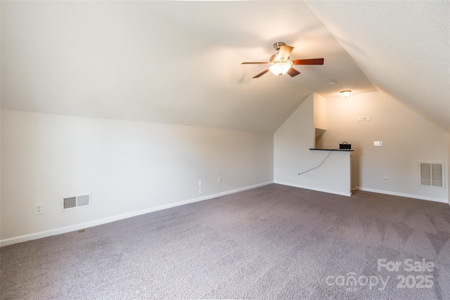 14924 Jerpoint Abby Dr, Charlotte, NC 28273 - additional living space with dark carpet, lofted ceiling, and a ceiling fan