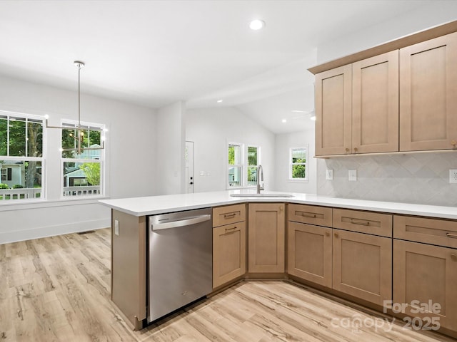 4113 Rutgers Ave, Charlotte, NC 28206 - kitchen with dishwasher, light wood finished floors, vaulted ceiling, light countertops, and a peninsula