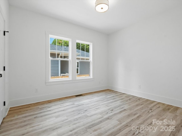 4113 Rutgers Ave, Charlotte, NC 28206 - empty room featuring light wood-style floors and baseboards