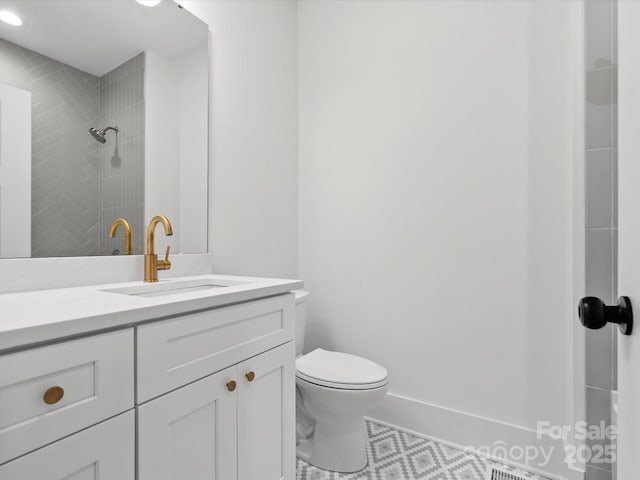 4113 Rutgers Ave, Charlotte, NC 28206 - bathroom featuring vanity, a tile shower, and tile patterned flooring