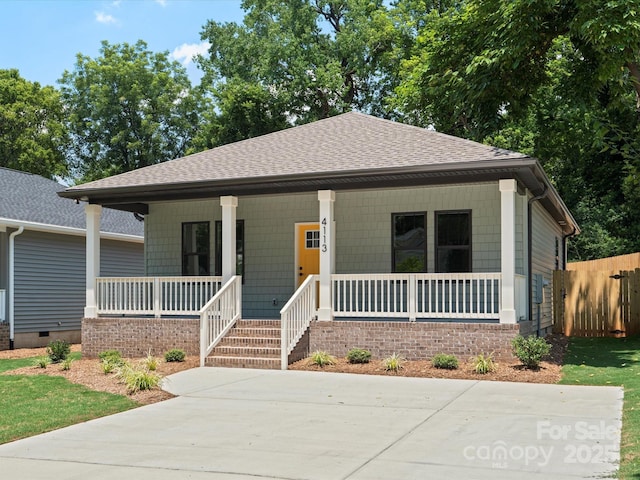 4113 Rutgers Ave, Charlotte, NC 28206 - bungalow-style house featuring covered porch, roof with shingles, and crawl space