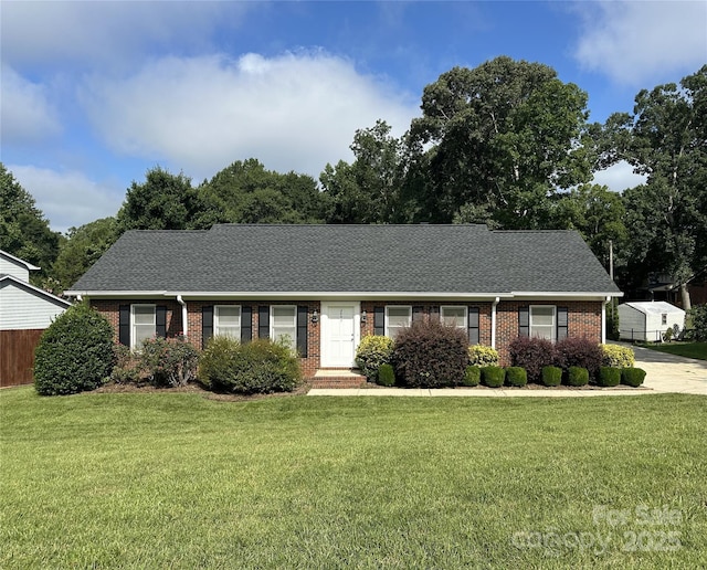 2443 1st Street Pl NW, Hickory, NC 28601 - single story home featuring brick siding, a front yard, and a shingled roof