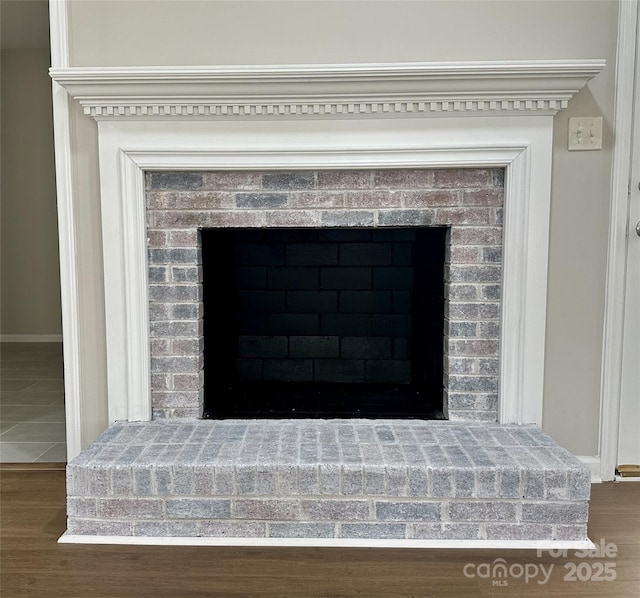 2443 1st Street Pl NW, Hickory, NC 28601 - detailed view of a brick fireplace and wood finished floors