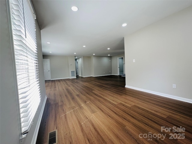 2443 1st Street Pl NW, Hickory, NC 28601 - unfurnished living room with dark wood-style flooring and recessed lighting