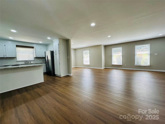 2443 1st Street Pl NW, Hickory, NC 28601 - unfurnished living room featuring dark wood-type flooring and recessed lighting