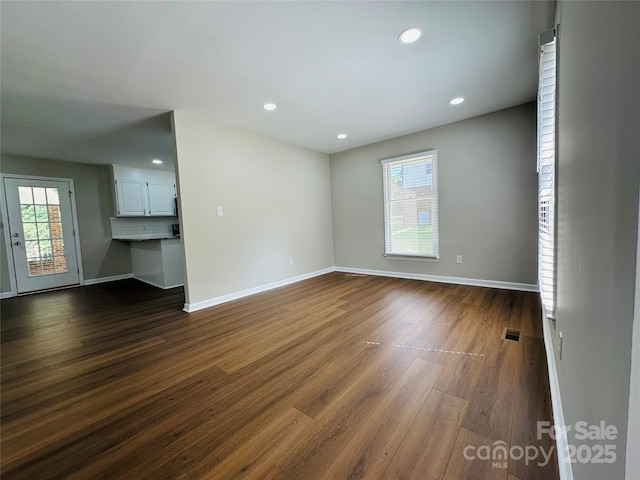 2443 1st Street Pl NW, Hickory, NC 28601 - unfurnished living room featuring dark wood-style floors and recessed lighting