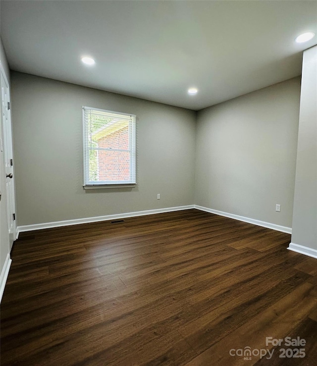 2443 1st Street Pl NW, Hickory, NC 28601 - empty room featuring dark wood-style flooring and recessed lighting