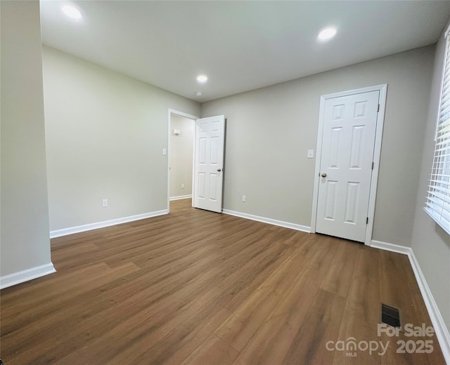 2443 1st Street Pl NW, Hickory, NC 28601 - unfurnished bedroom with wood finished floors and recessed lighting