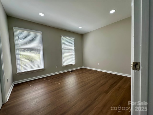2443 1st Street Pl NW, Hickory, NC 28601 - empty room featuring plenty of natural light, dark wood-type flooring, and recessed lighting