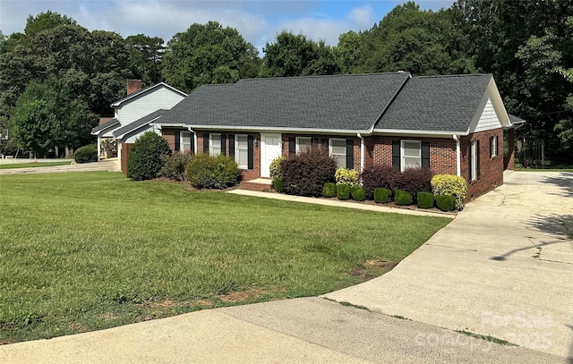 2443 1st Street Pl NW, Hickory, NC 28601 - view of front of property featuring driveway, brick siding, a front lawn, and a shingled roof