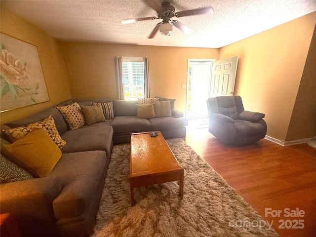 2832 Laurel Ln, Lenoir, NC 28645 - living room with a textured ceiling, wood finished floors, and a ceiling fan