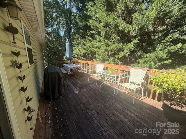 2832 Laurel Ln, Lenoir, NC 28645 - wooden terrace featuring a grill and outdoor dining space