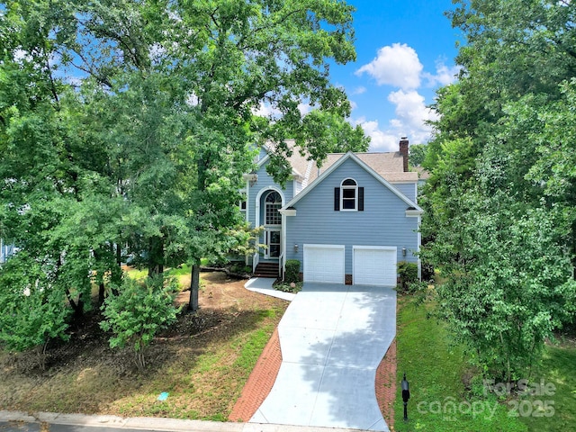 10807 Summitt Tree Ct, Charlotte, NC 28277 - view of front of property with driveway, an attached garage, and a chimney