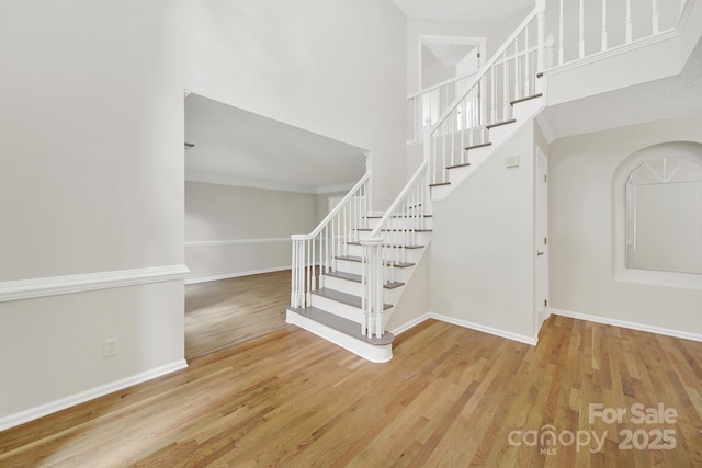 10807 Summitt Tree Ct, Charlotte, NC 28277 - staircase with wood finished floors and a high ceiling