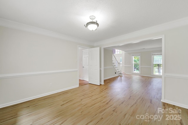 10807 Summitt Tree Ct, Charlotte, NC 28277 - empty room with crown molding, stairway, and light wood-style floors