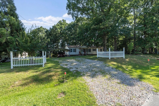 115 Red Fox Ct, Mount Holly, NC 28120 - view of front facade with a detached carport and gravel driveway