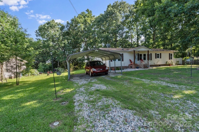 115 Red Fox Ct, Mount Holly, NC 28120 - view of grassy yard featuring driveway and a carport