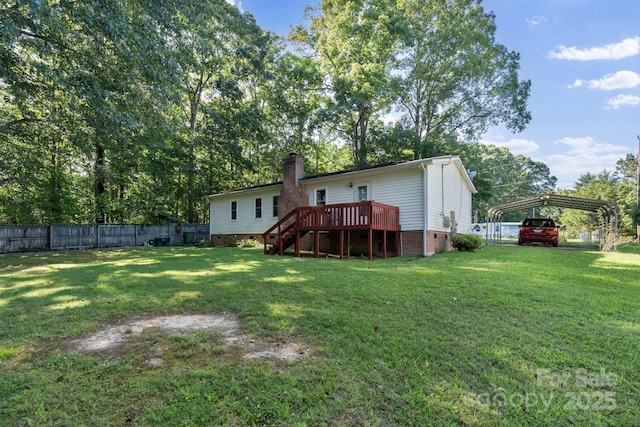 115 Red Fox Ct, Mount Holly, NC 28120 - rear view of house with a wooden deck, stairway, a detached carport, and a chimney