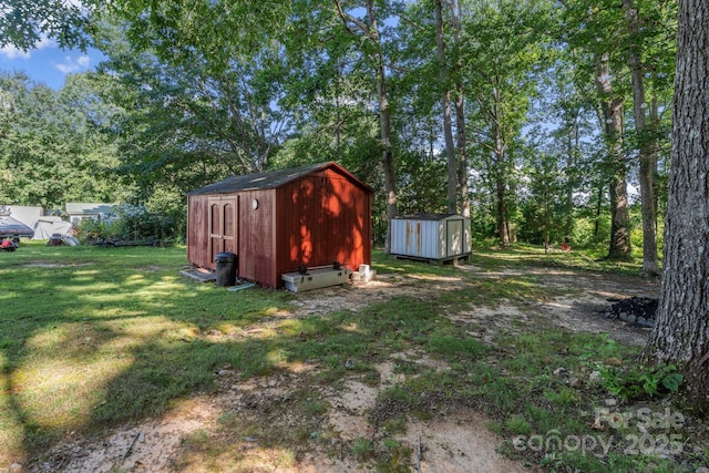 115 Red Fox Ct, Mount Holly, NC 28120 - view of green lawn with a storage unit