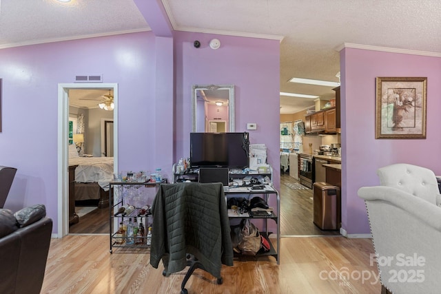 115 Red Fox Ct, Mount Holly, NC 28120 - office space with light wood-type flooring, a textured ceiling, crown molding, and ceiling fan