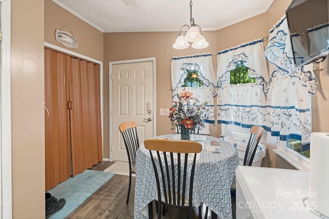 115 Red Fox Ct, Mount Holly, NC 28120 - dining area featuring wood finished floors, crown molding, and a textured ceiling