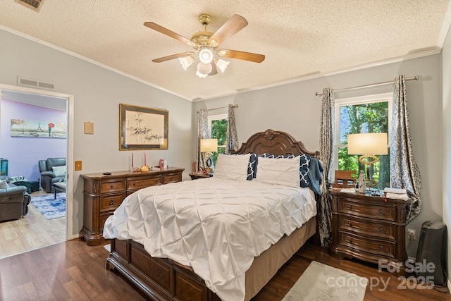 115 Red Fox Ct, Mount Holly, NC 28120 - bedroom featuring dark wood finished floors, a textured ceiling, lofted ceiling, ornamental molding, and a ceiling fan