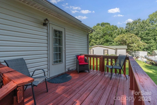 115 Red Fox Ct, Mount Holly, NC 28120 - wooden deck with an outdoor structure