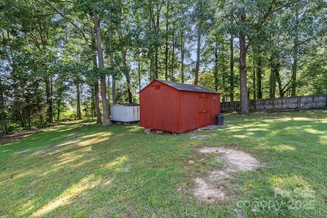 115 Red Fox Ct, Mount Holly, NC 28120 - view of yard with a storage shed and view of wooded area