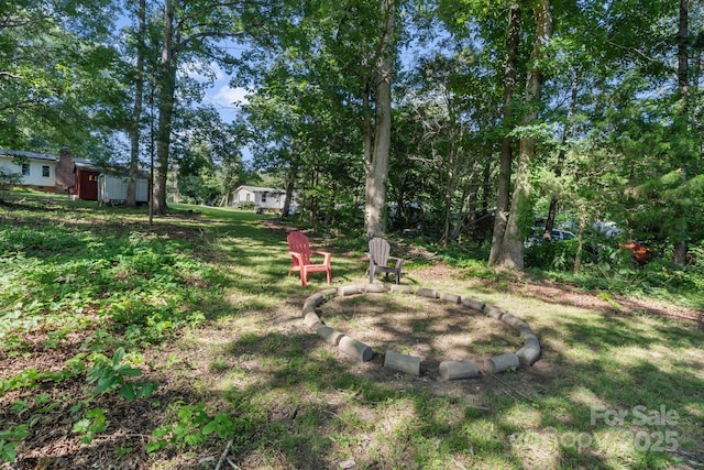 115 Red Fox Ct, Mount Holly, NC 28120 - view of grassy yard featuring a fire pit