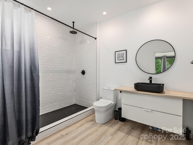 1761 Williamson Creek Rd, Pisgah Forest, NC 28768 - full bath featuring vanity, tiled shower, wood finished floors, and recessed lighting
