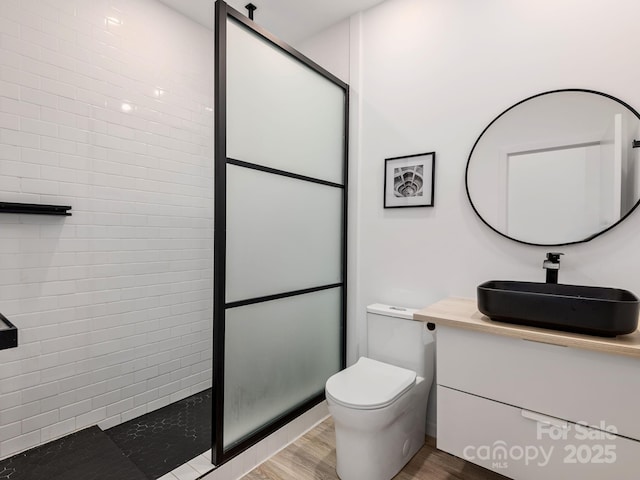 1761 Williamson Creek Rd, Pisgah Forest, NC 28768 - full bathroom featuring vanity, wood finished floors, and tiled shower